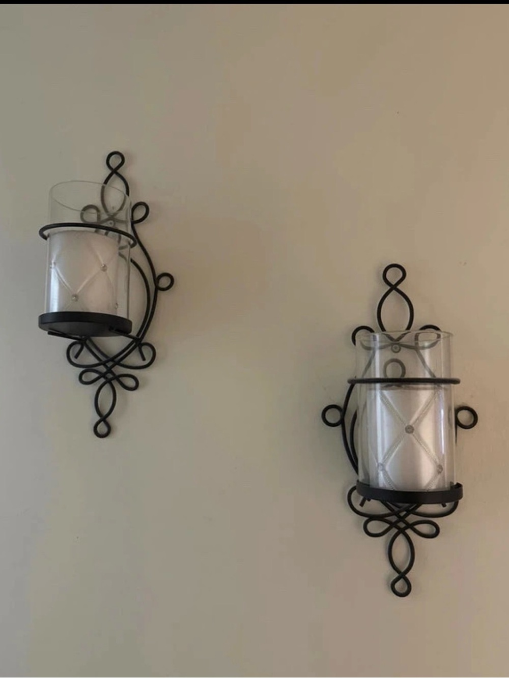 Black Scroll Metal Wall Sconce Pair with Clear Glass Candle Holders
